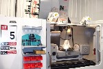CNC VERTICAL MACHINING CENTERS: HAAS VF-5 CNC MILL, 50 x 26 x 25, 10000 RPM, 5-AXIS W/TRUNNION ROTARY TBL, COOLANT THRU SPINDLE, GEARBOX, PROBES, 2007, Click to view larger photo...