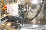 CNC VERTICAL MACHINING CENTERS: HAAS VF-5 CNC MILL, 50 x 26 x 25, 10000 RPM, 5-AXIS W/TRUNNION ROTARY TBL, COOLANT THRU SPINDLE, GEARBOX, PROBES, 2007, Click to view larger photo...